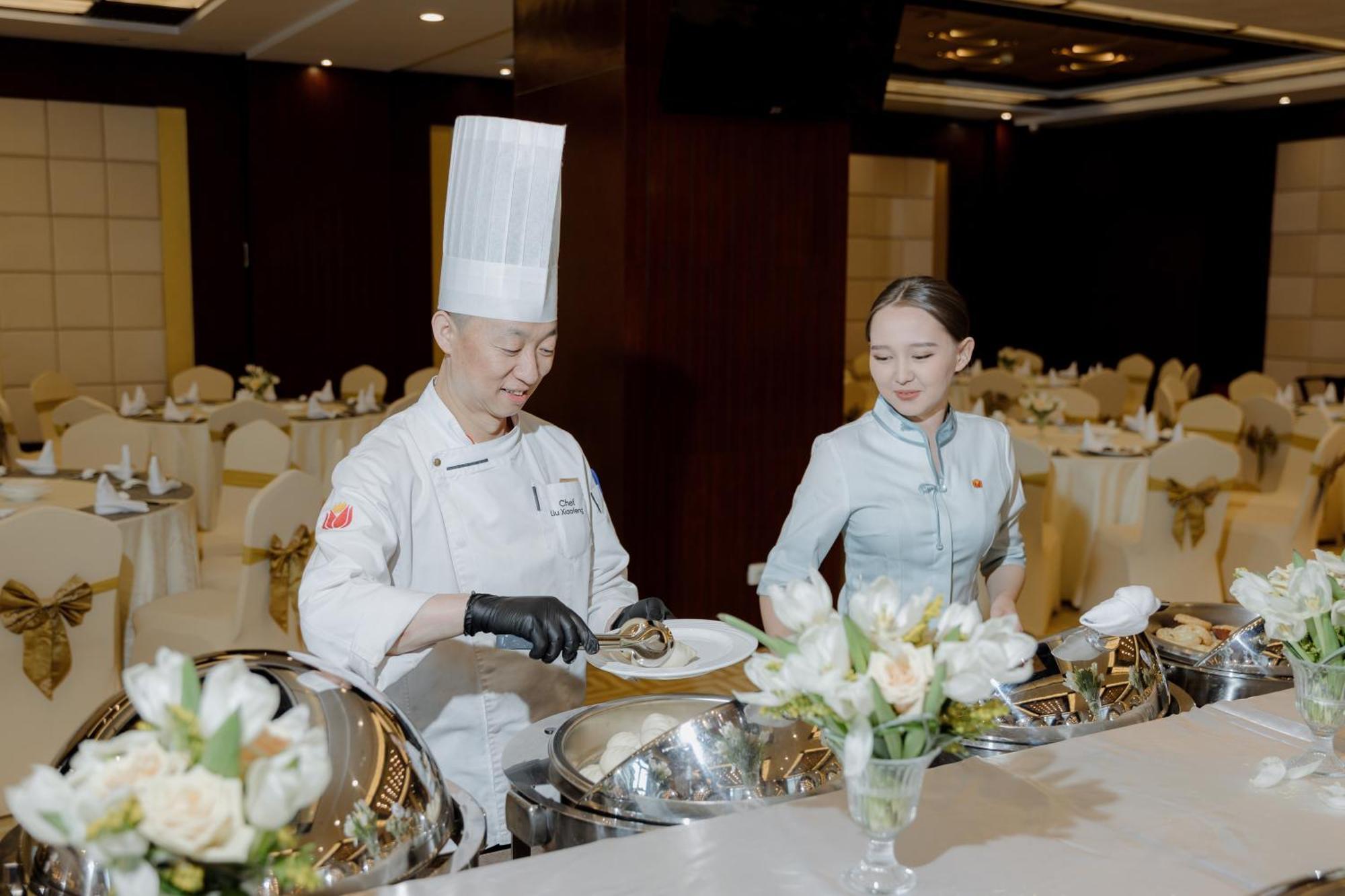 Beijing Palace Soluxe Hotel Astana Bagian luar foto A buffet at a wedding reception